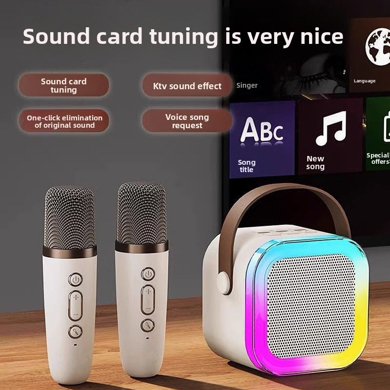 Two microphones and a colorful Bluetooth speaker on a wooden surface with text about sound card tuning.