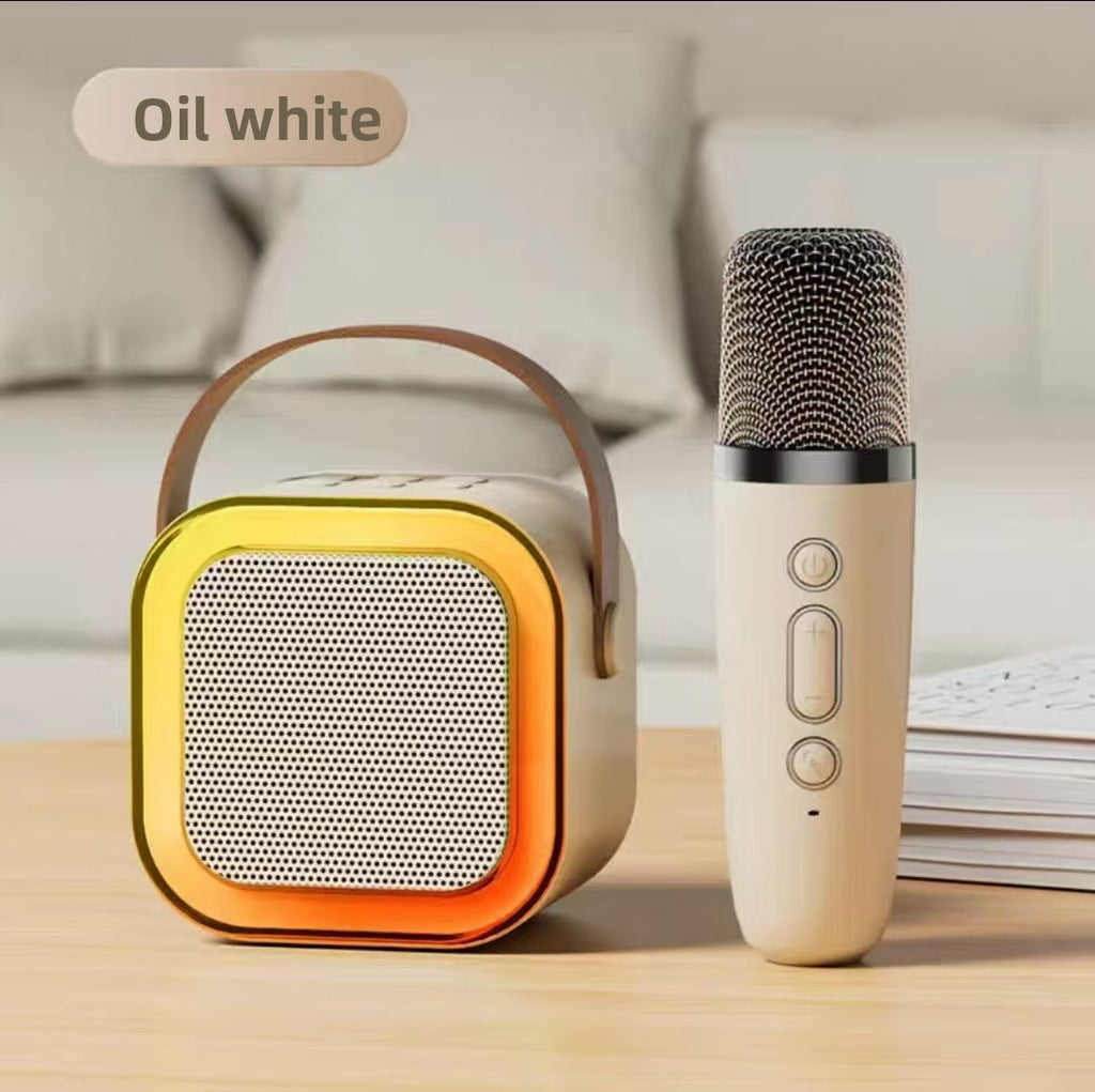 Portable Bluetooth speaker and microphone on a wooden surface with a neutral background